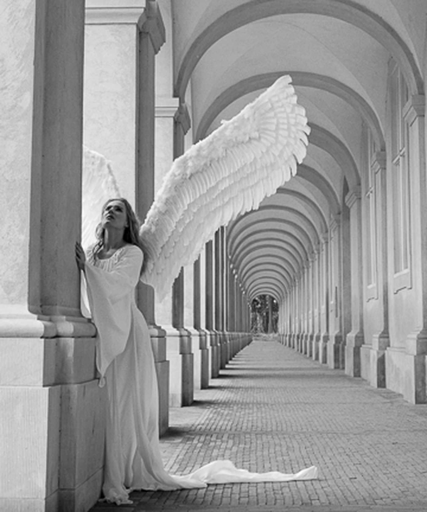Serenity by Kerry Swank featuring an angelic figure beneath arched corridors symbolizing peace, healing, faith, hope, and spiritual guidance through light and quiet reflection.