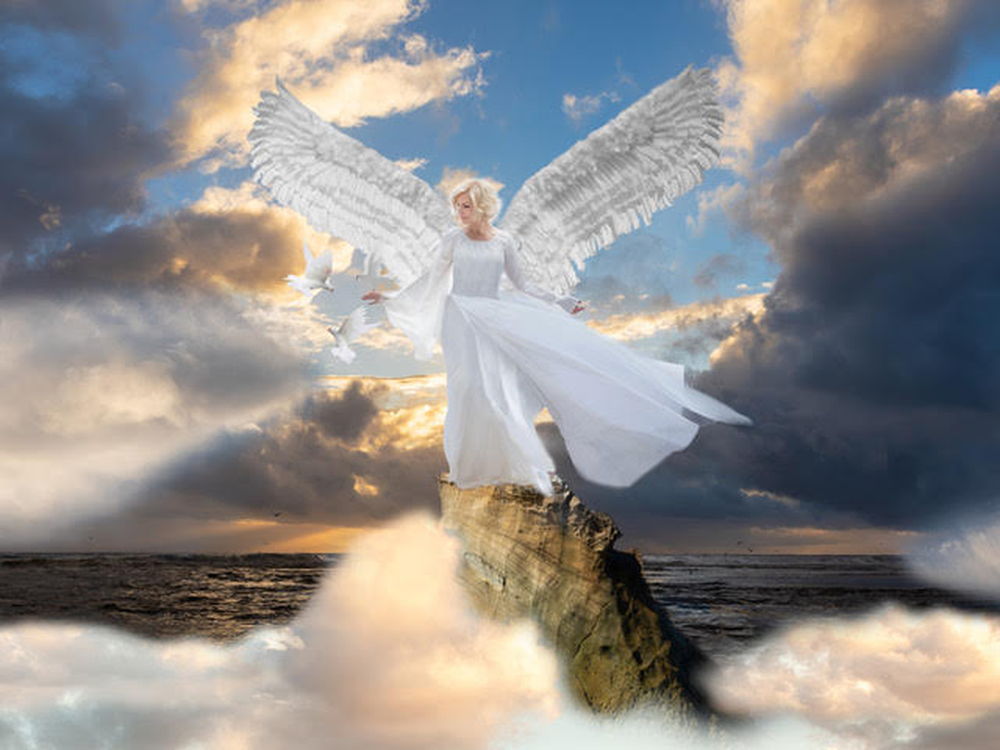 An artistic depiction of a woman with angel wings standing on a rock in the ocean during sunset, with clouds in the sky and a few birds flying around her.