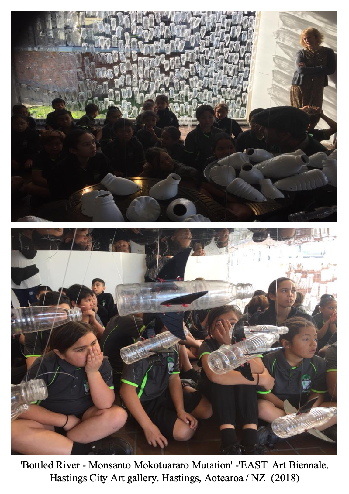 Children sitting on the floor and looking at art installations in a gallery, with some of them covering their mouths. The art includes plastic bottles and containers transformed into marine life, such as fish, and skull-like objects. A woman is standing with arms crossed in the background.