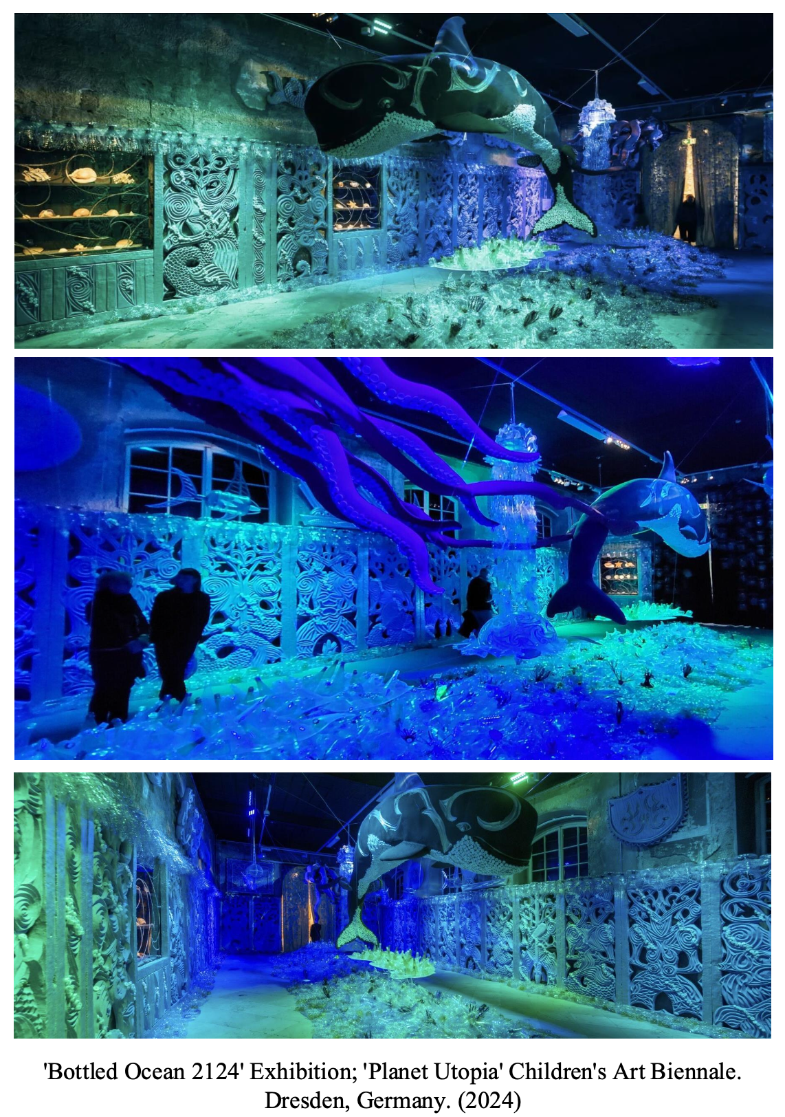 Art installation of artificial ocean scene called 'Bottled Ocean 2124' at 'Planet Utopia' Children's Art Biennale in Dresden, Germany, 2024. Features large whale and octopus sculptures illuminated with blue and green lights, surrounded by intricate carved panels and decorative elements.