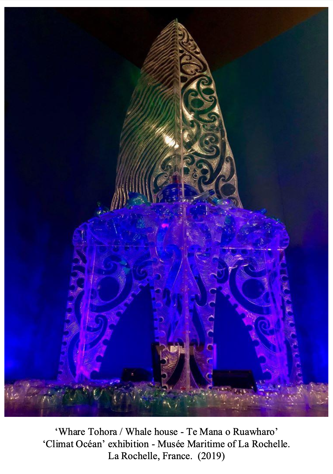 Colorful, illuminated sculpture resembling a whale house, part of the Climate Ocean exhibition at the Maritime Museum of La Rochelle, France, 2019.