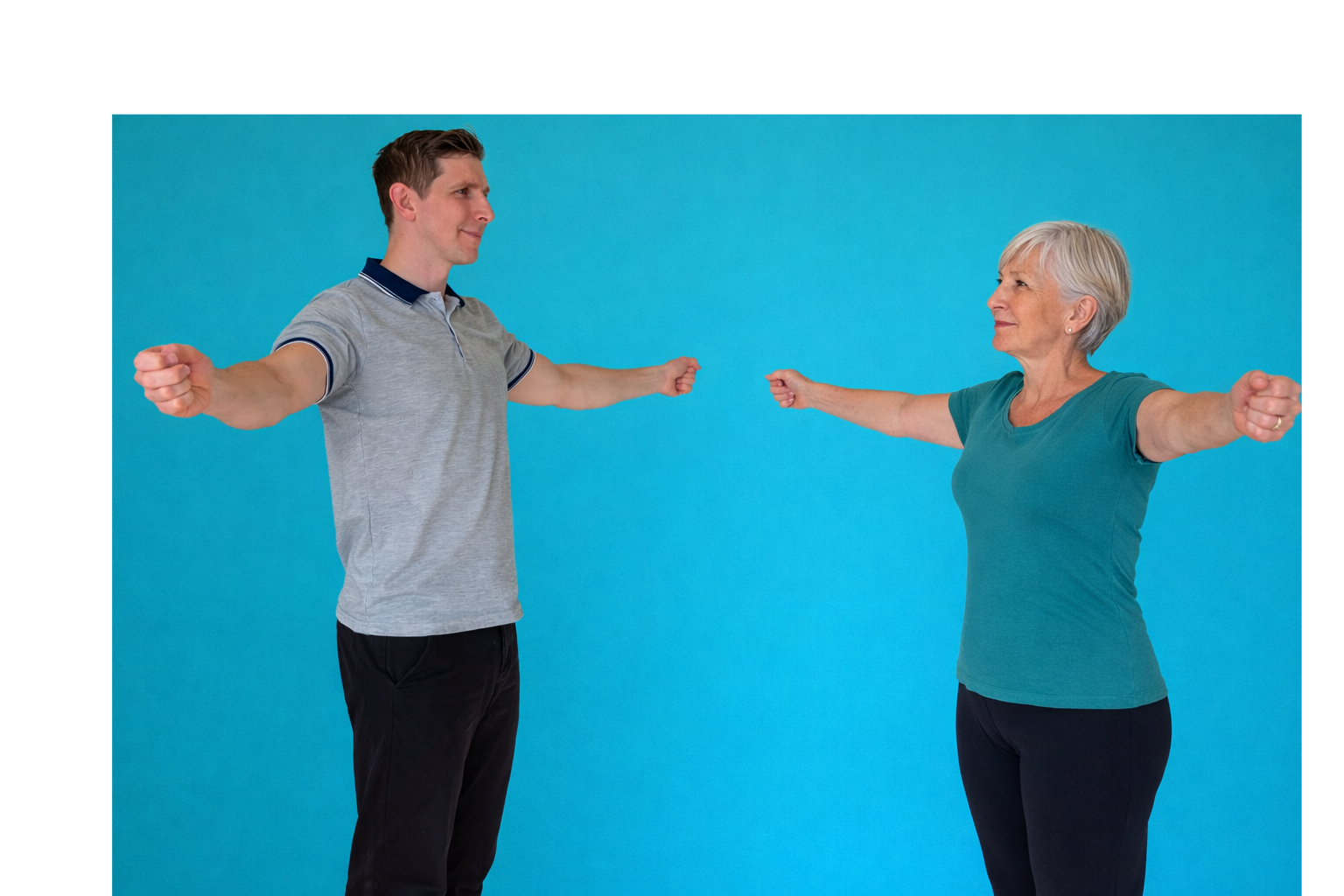 A young man and an older woman are stretching with their arms outstretched, facing each other against a blue background.