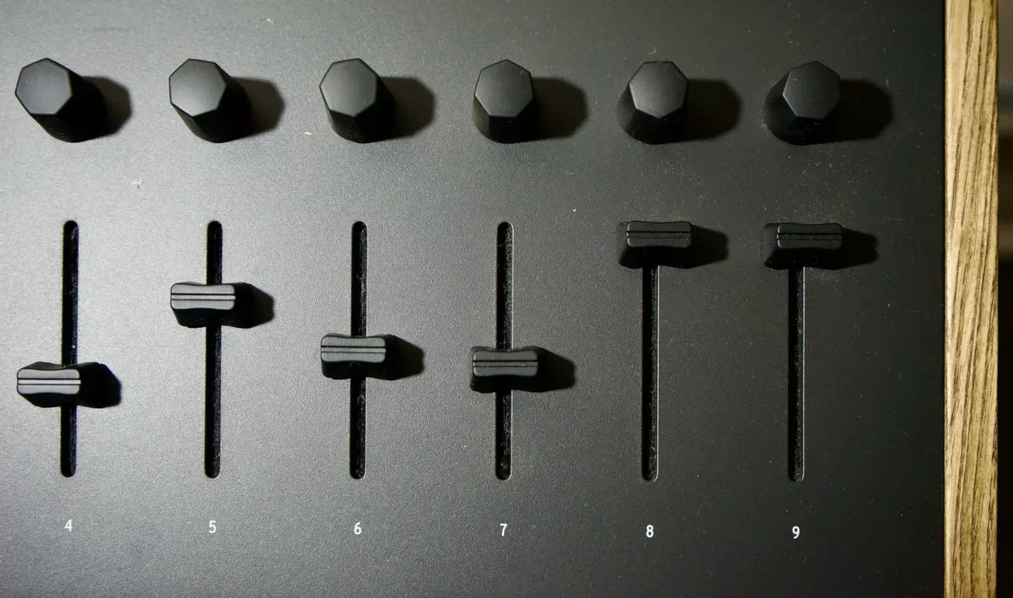 faders on a mixing desk