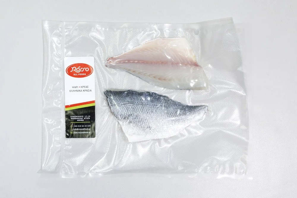 Vacuum-sealed fish fillets, including white fish and gray fish, with a label from Ross All Foods.