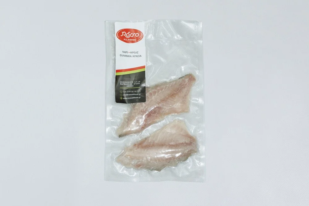 Packaged raw chicken breast fillets in vacuum-sealed plastic with a label from Rosso All Foods.