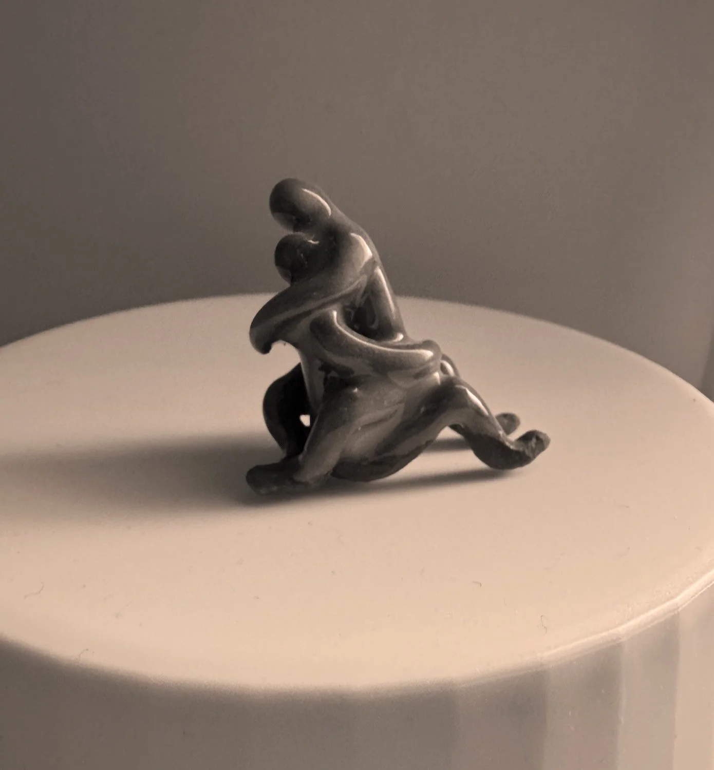 Ceramic sculpture of a couple in Yab Yum embrace, representing intimacy, trust, devotion, and sacred partnership.