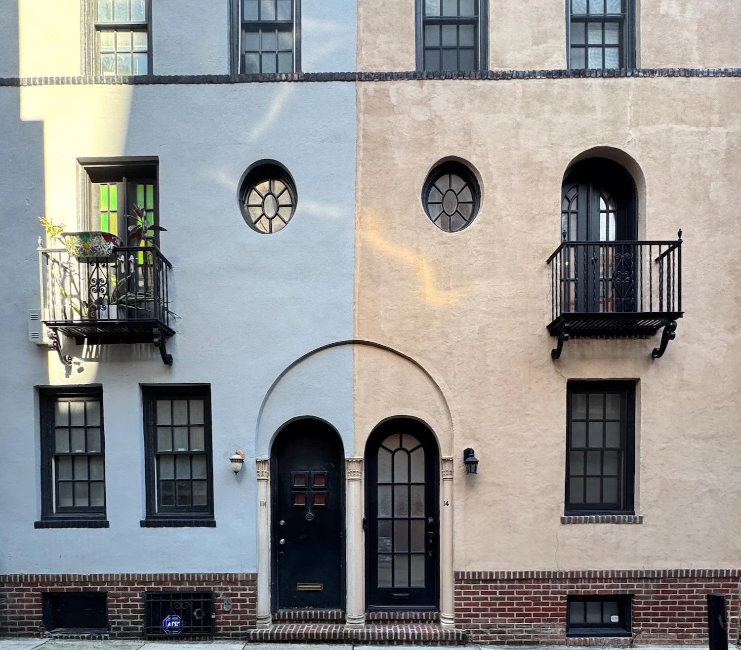 Historic Philadelphia building with an arched entrance and contrasting light and shadow, representing transition, transformation, and crossing a threshold into something new.
