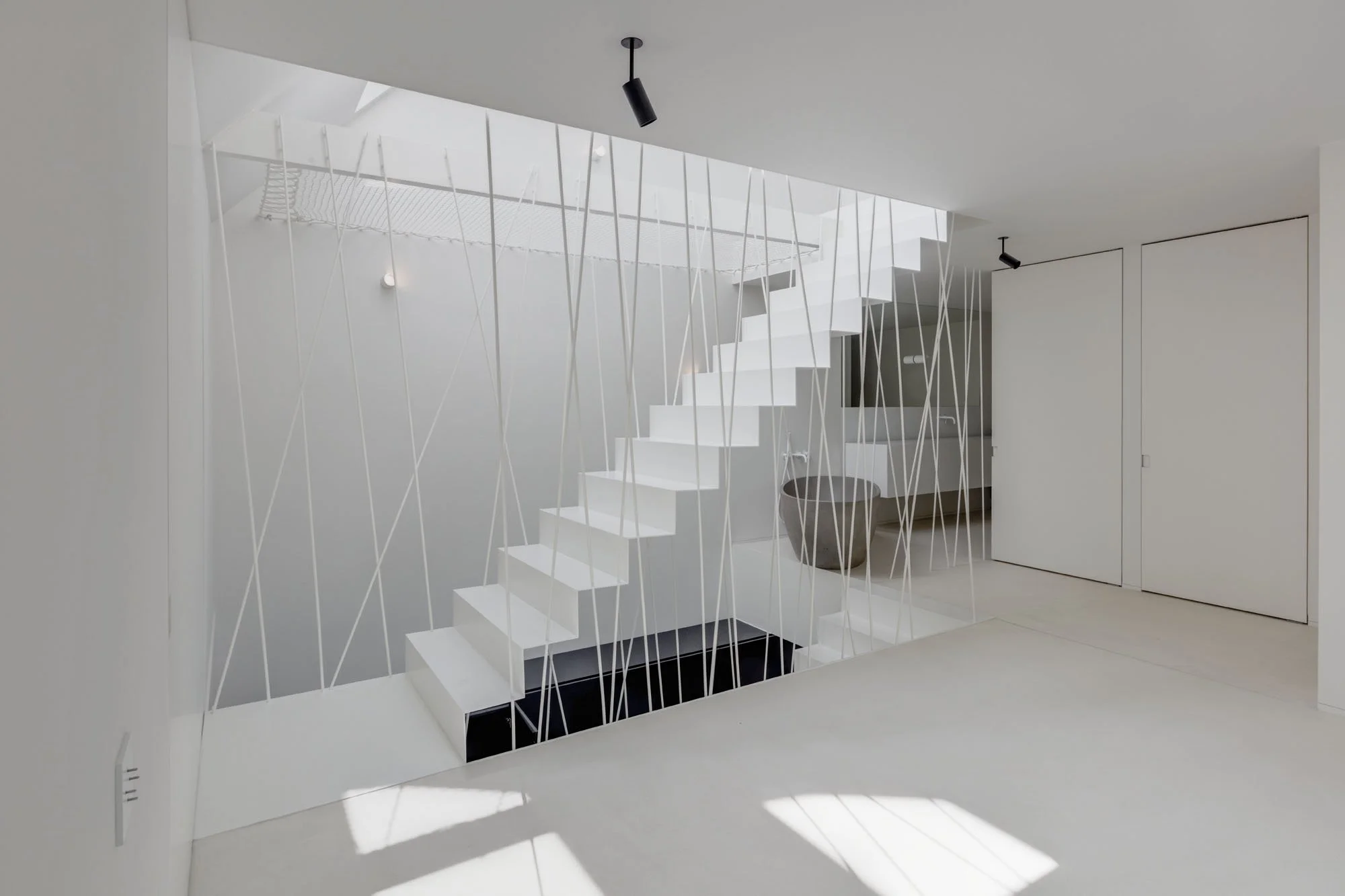 Een sculpturale designtrap als blikvanger in Brasschaat