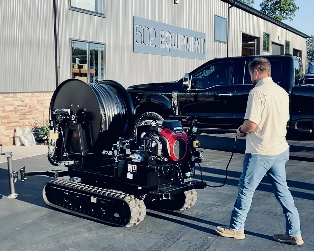 A man operating an remote controle easement machine for vac trucks outside the 502 Equipment Service Center in LaGrange, KY.