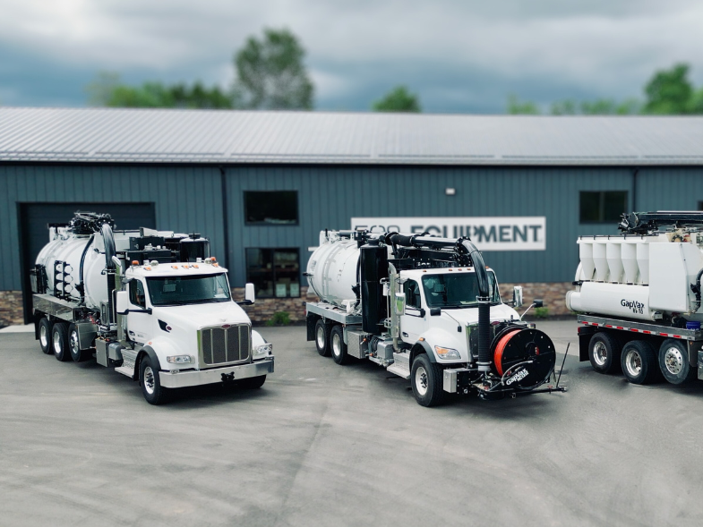 Three GapVax rental vacuum trucks parked in front of the 502 Equipment service center in Lagrange, KY