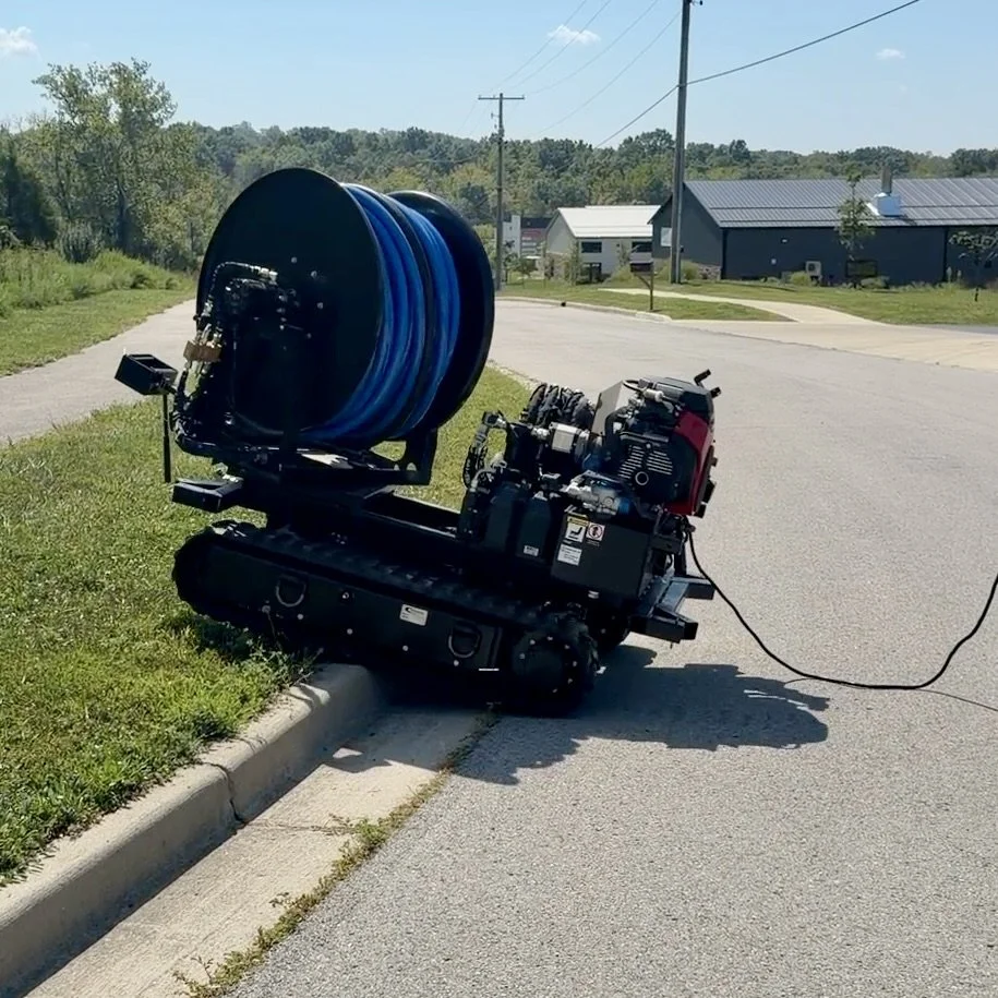 tracked-easement-machine-over-curb-502-equipment.jpeg