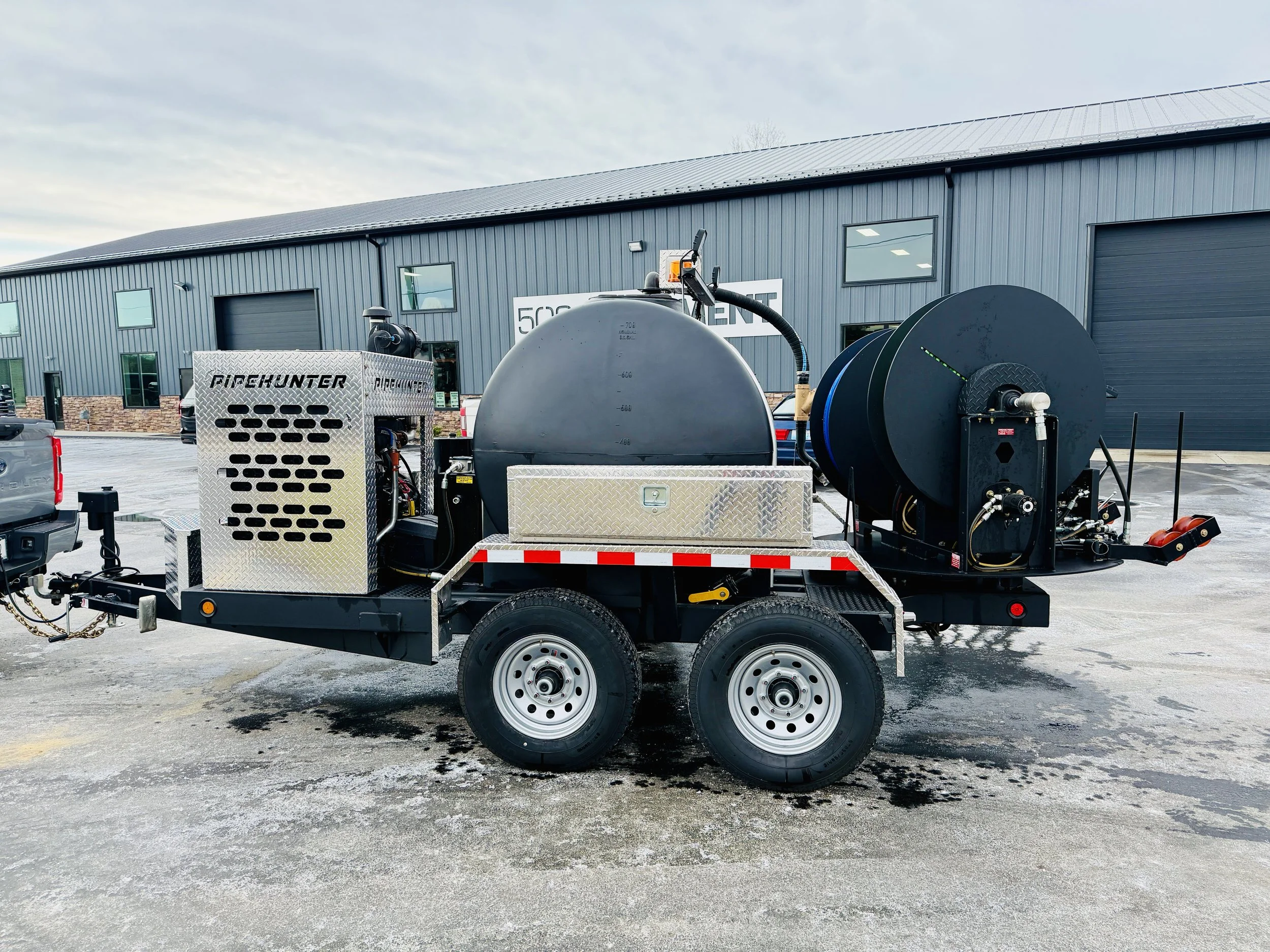 A PipeHunter trailer jetter parked in front of the 502 equipment service center in lagrage, KY