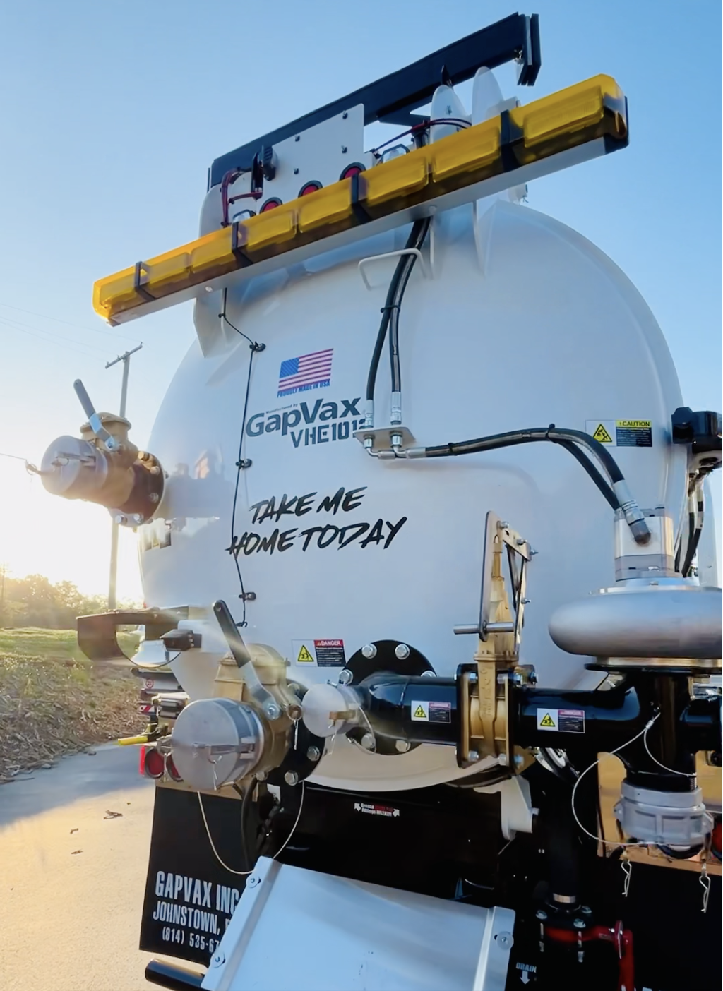 Close-up of a large GapVax VHE vac truck back tank set outdoors during daytime with a clear sky in Nashville, Tennessee.