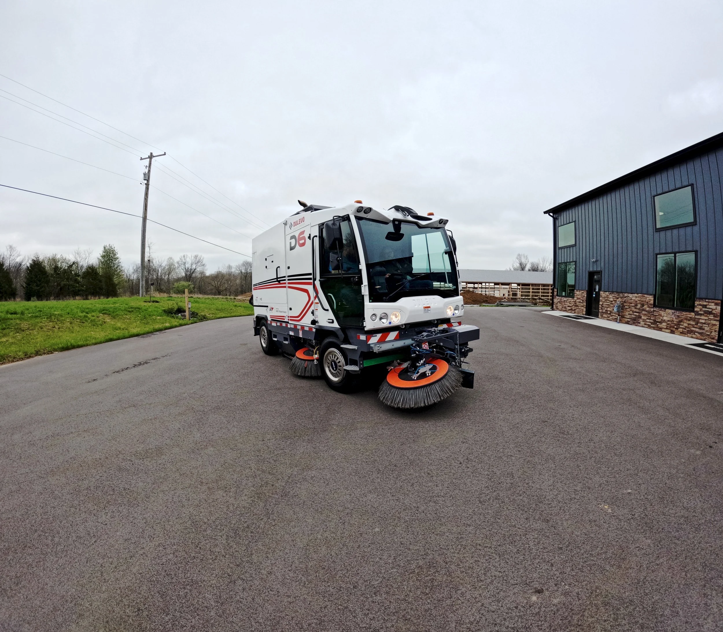 Dulevo D3 industrial sweeper with front broom and mechanical suction parked outside the 502 Equipment Service Center in LaGrange, KY.