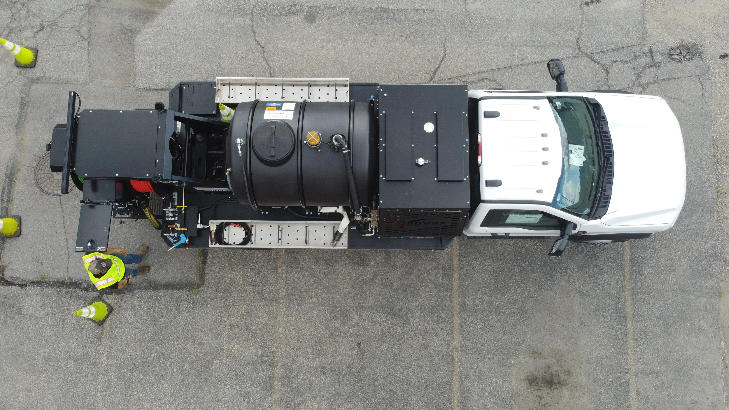 An aerial view of the gapvax g7t, a powerful truck mounted jetter with 2 sizes of hose reels is parked in a gravel lot near Nashville, TN