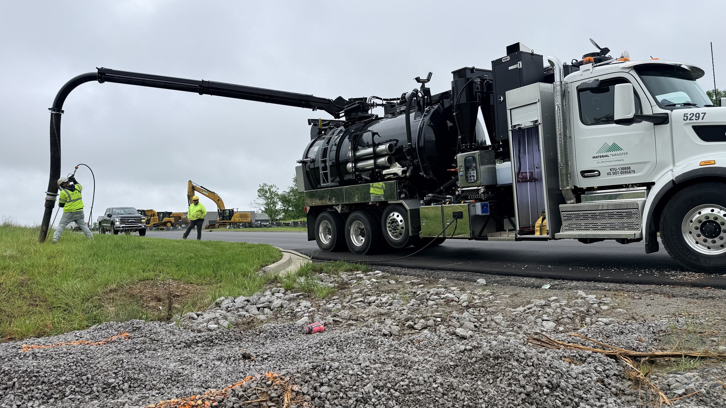 Construction crew locating underground utilities using a 2026 GapVax VHE hydro excavator.