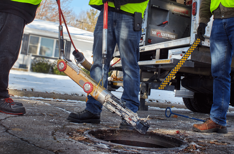 Workers using an Aries wolverine robotic cutting system sold by 502 Equipment inside a pipe to cut protruding taps near Cookeville, Tn.