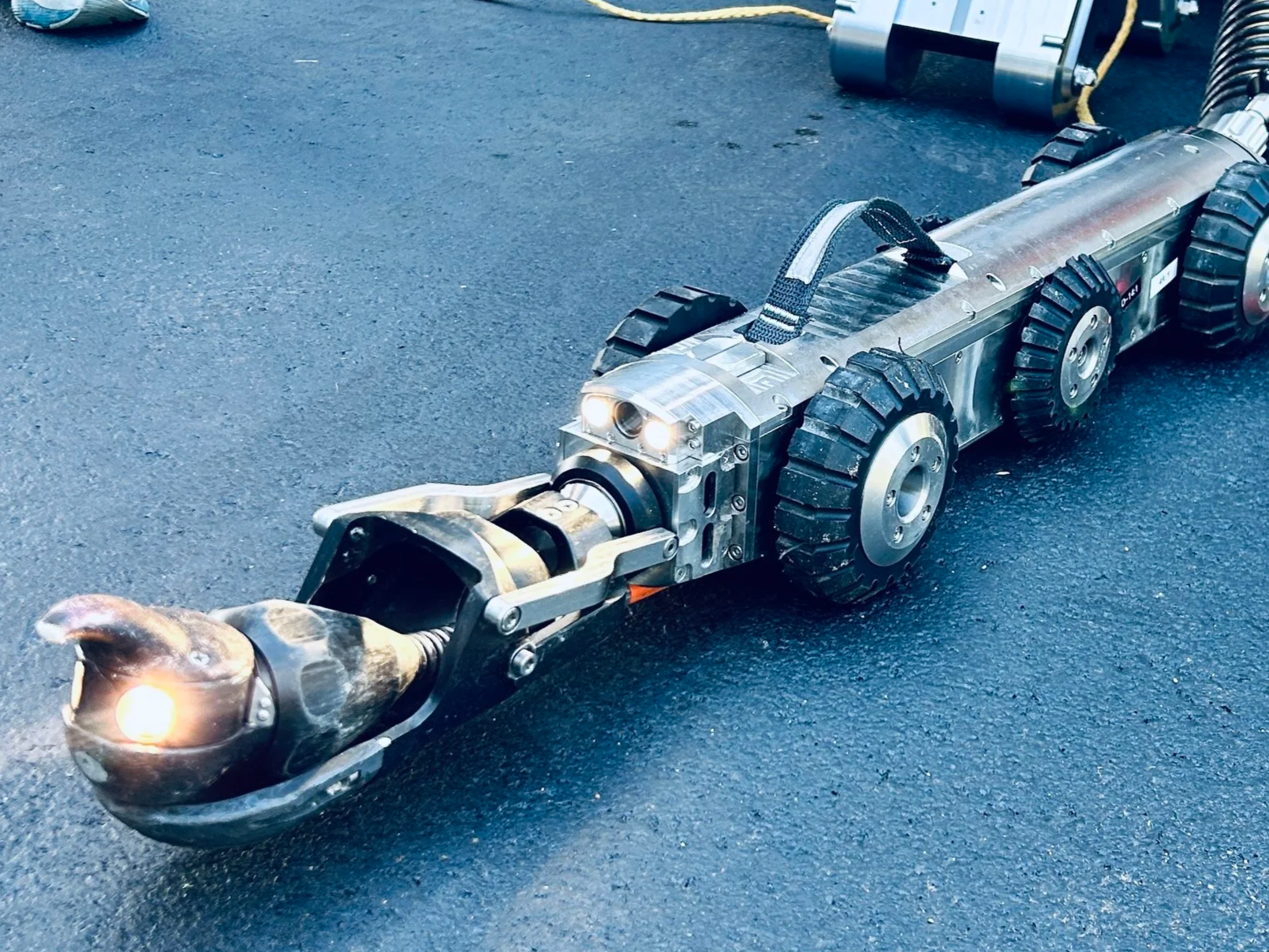 The Aries LETS lateral inspection system is a metal robotic camera with wheels and sold by 502 Equipment in Kentucky, Indiana and Tennessee.