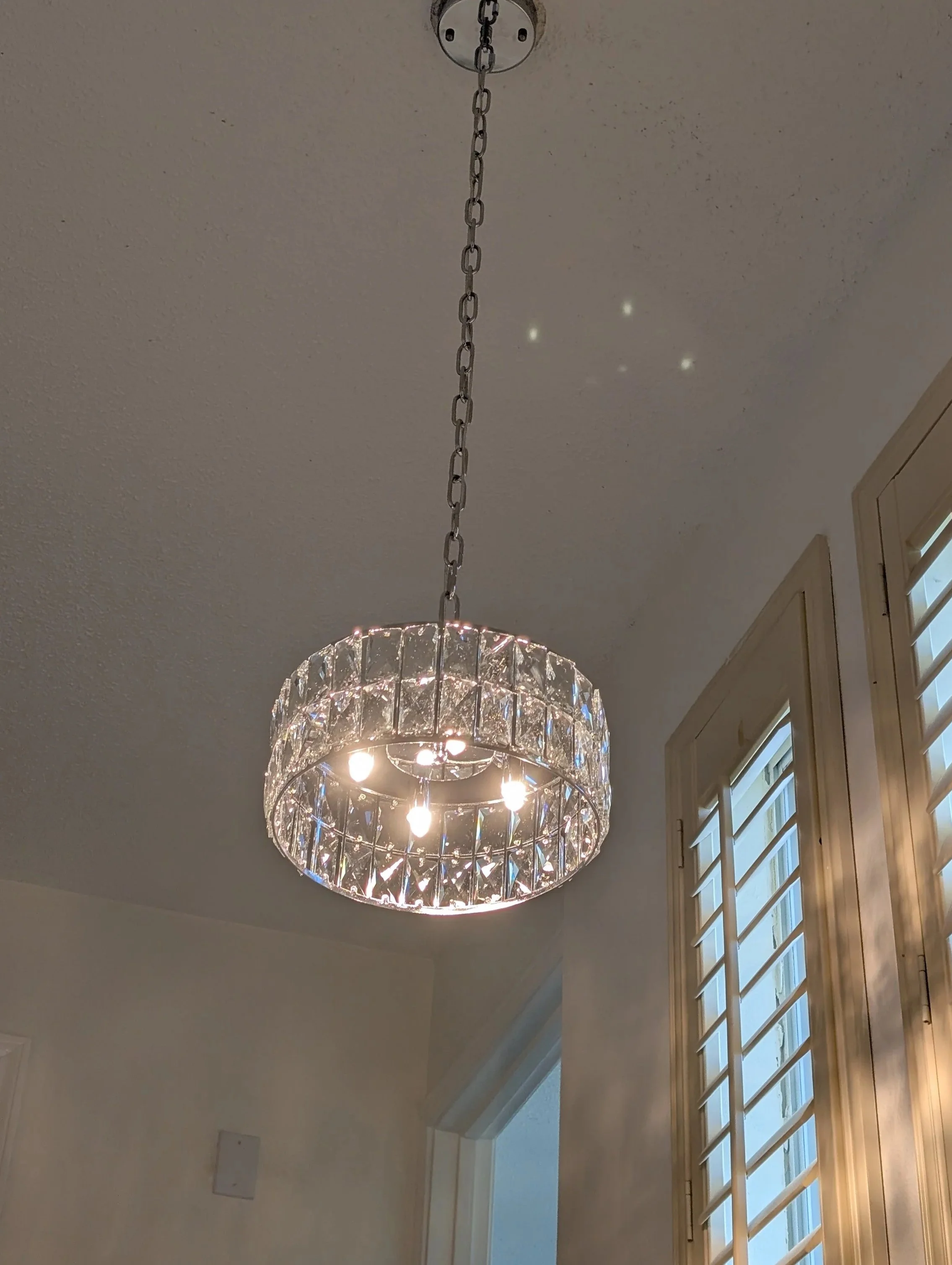 Stairway chandelier replaced in Lewisville, TX - After