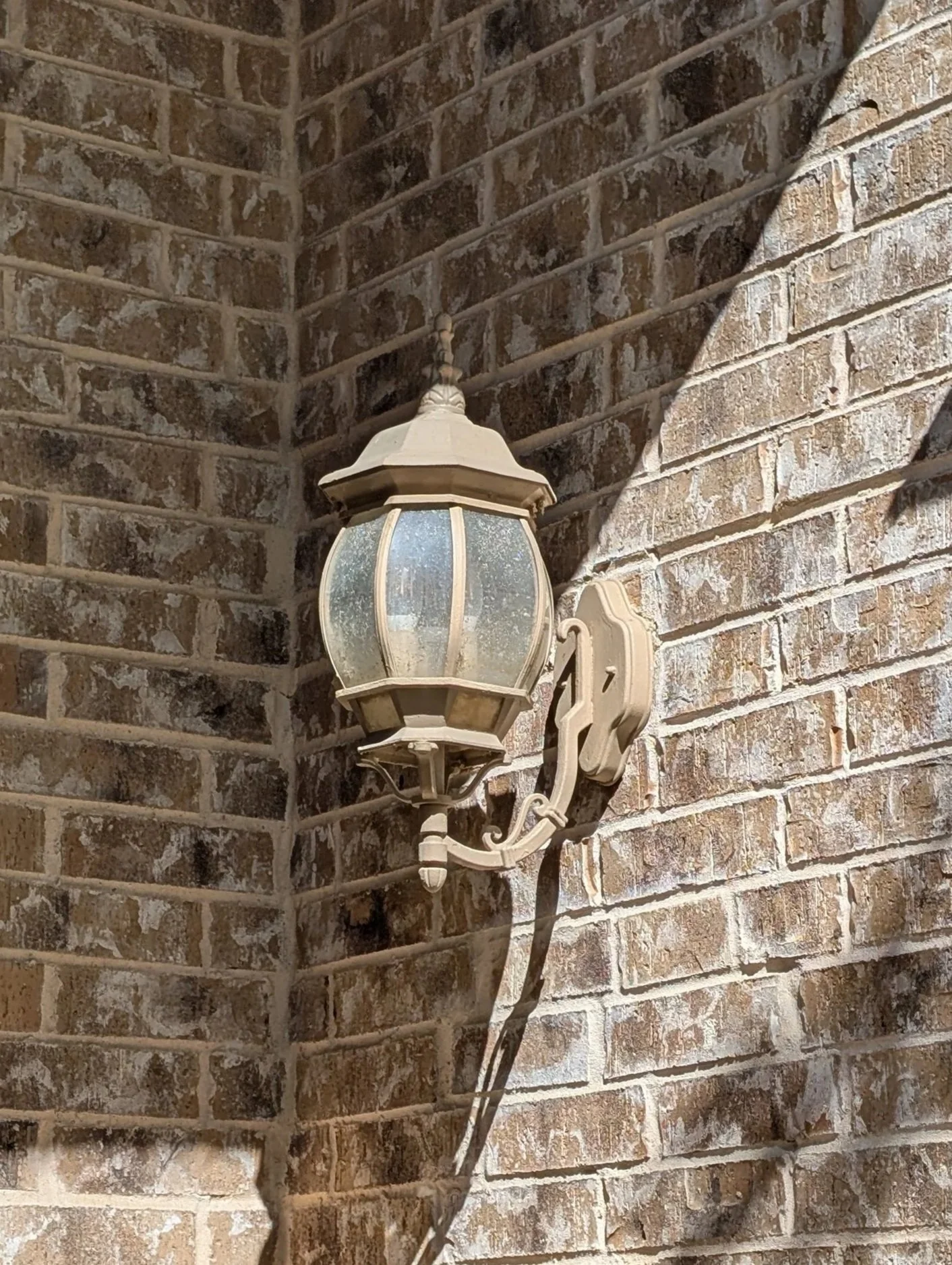 Exterior sconce replaced in Denton, TX - before
