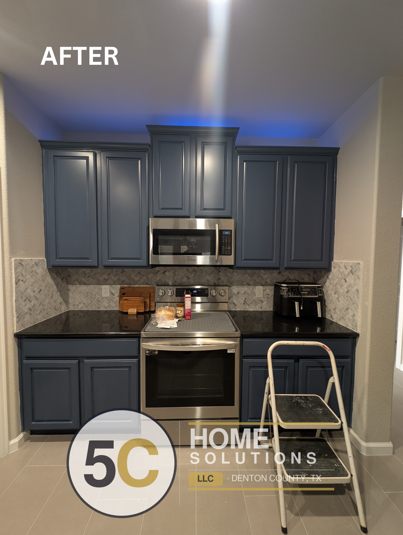 Freshly painted slate blue cabinets pair with a new gray herringbone mosaic backsplash and black granite countertops in this Lake Dallas kitchen remodel. The cohesive color palette and updated tile give the space a modern, move-in-ready feel.