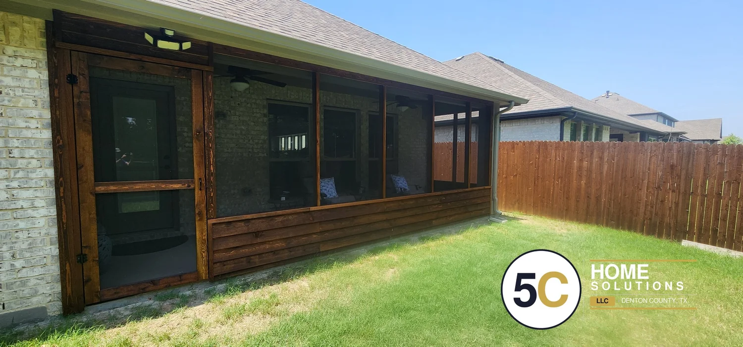 Cedar screened-in patio with dark stain and custom screen door in Denton County, TX