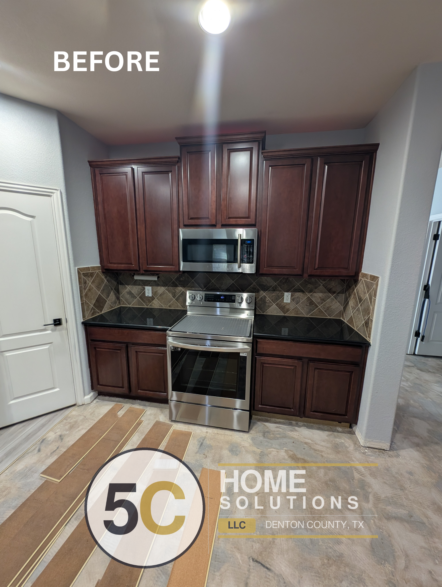 Before photo of the Lake Dallas kitchen showing the original dark cherry cabinetry and diagonal-set tile backsplash. New flooring materials are staged on the subfloor ahead of the remodel.