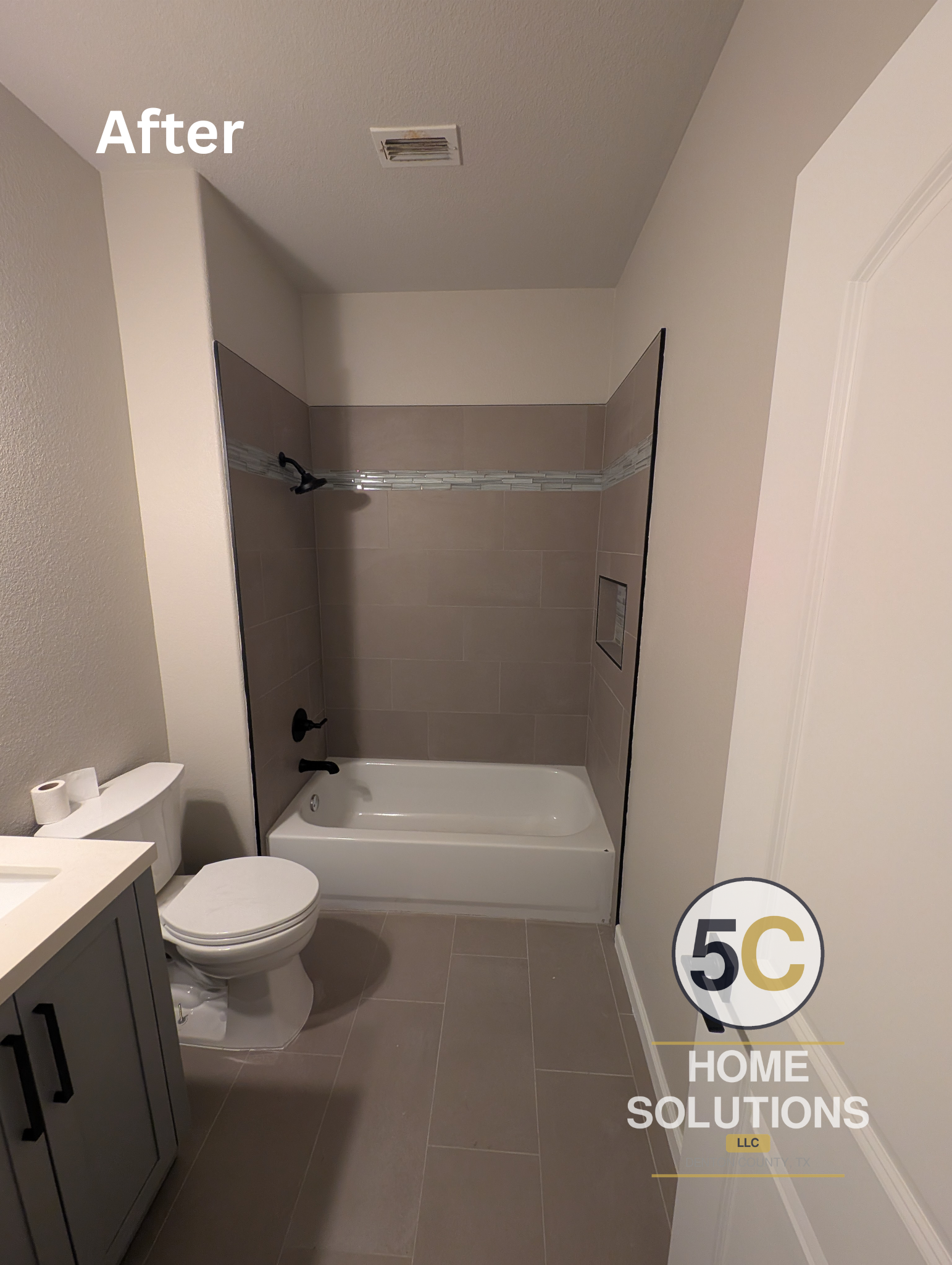 New tub/shower surround featuring large-format taupe tile, a glass mosaic accent band, recessed niche, and matte black fixtures — a full guest bathroom update in Lake Dallas, TX.