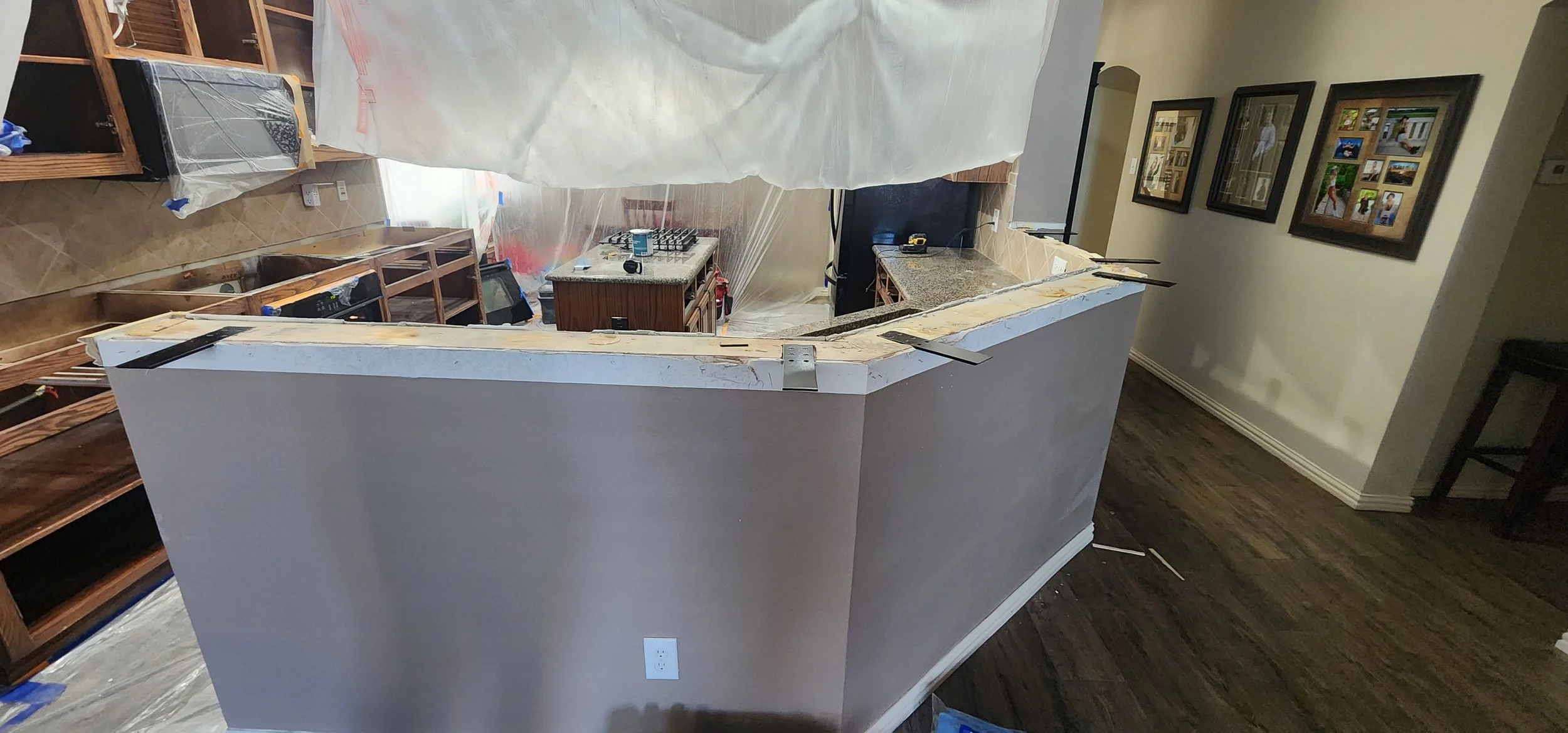 Re-stained cabinets and new granite countertops in this Lantana kitchen renovation.