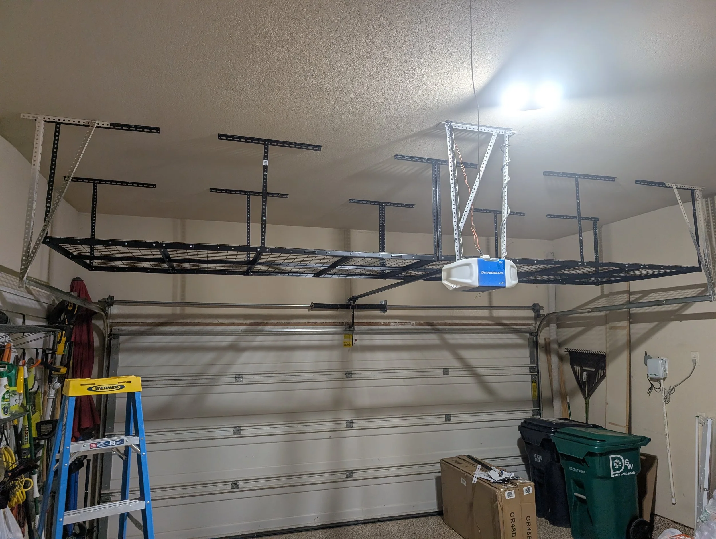 Garage ceiling in Denton, TX after overhead shelving was installed.