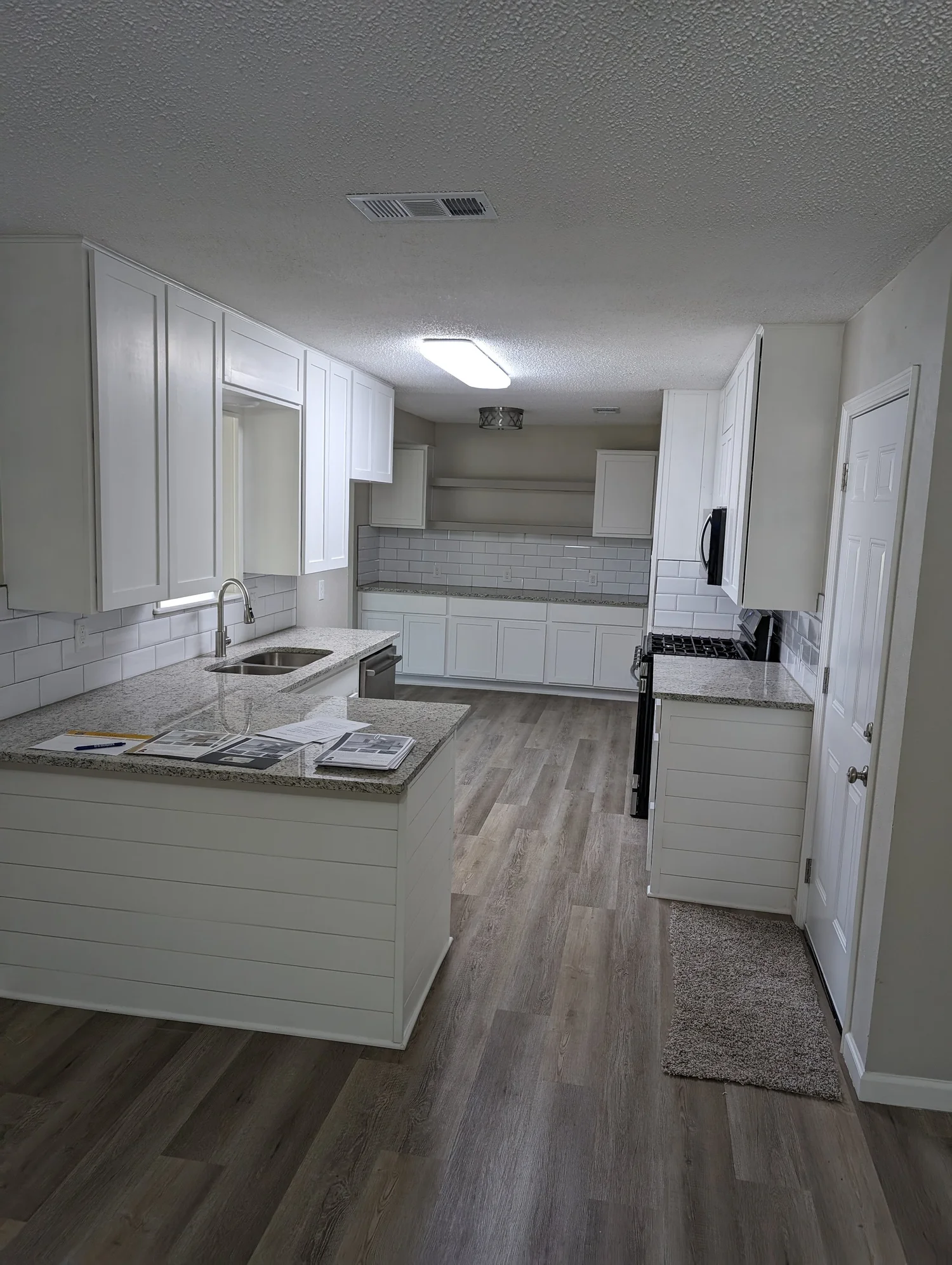 Kitchen remodeling with white shaker cabinets and granite countertops by 5C Home Solutions Denton TX