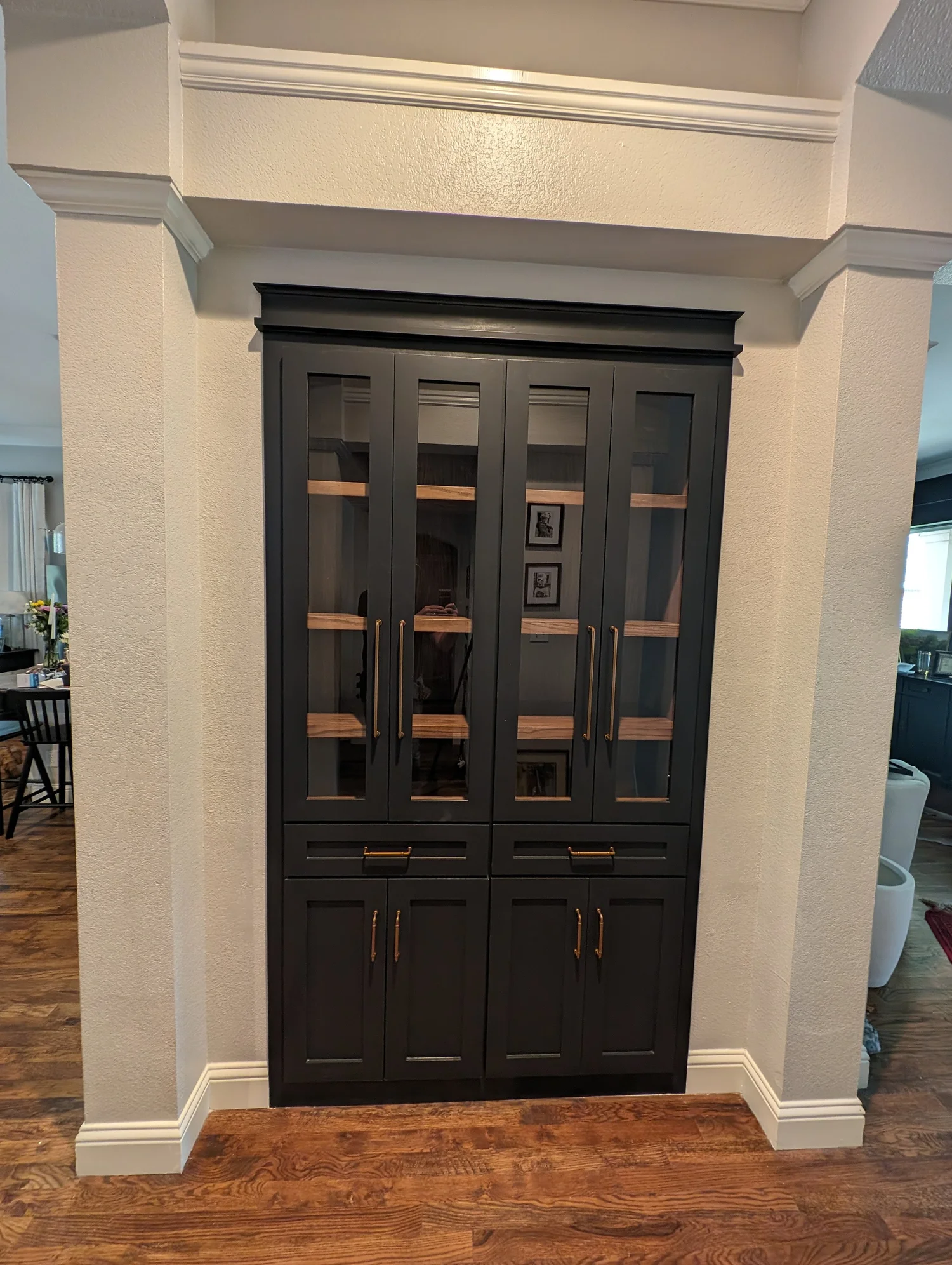Custom hallway cabinet build with glass doors and gold hardware by 5C Home Solutions Flower Mound TX