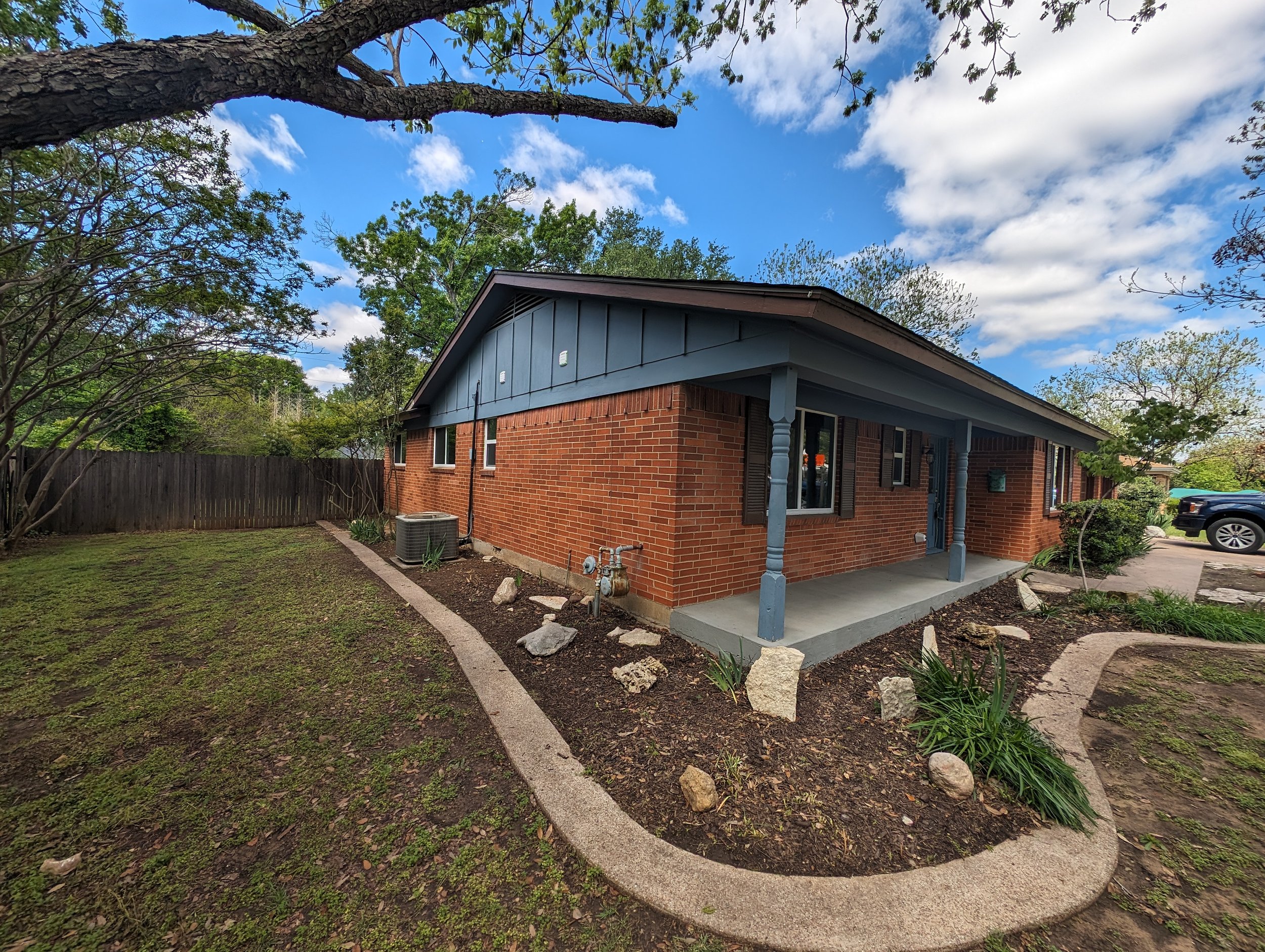 Angle shot of a home before exterior painting by Ray Cobb