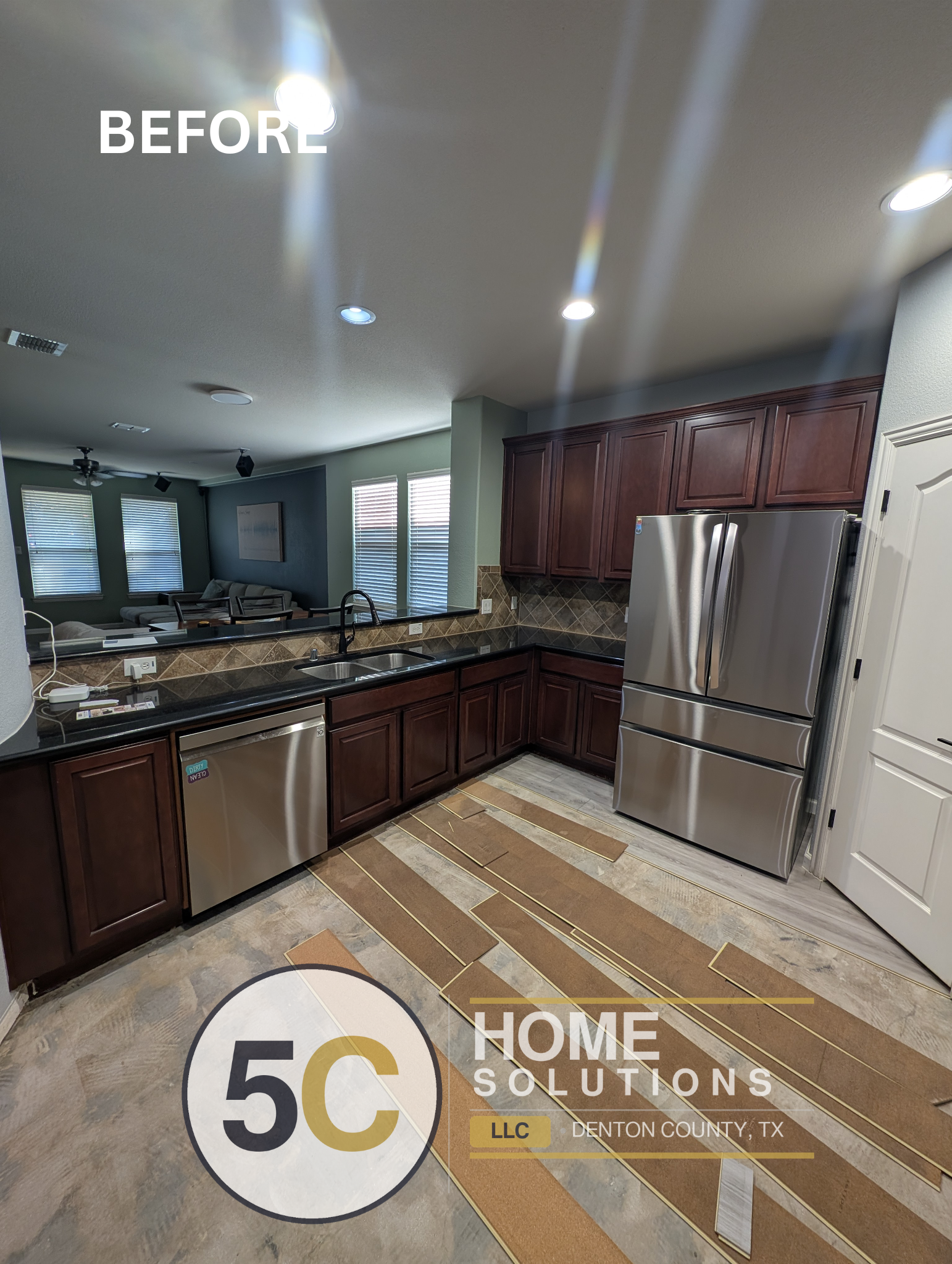 A wider before shot of the Lake Dallas kitchen highlighting the original cherry wood cabinets, diamond-pattern tile backsplash, and outdated flooring — set for a full cabinet repaint and finish upgrade.