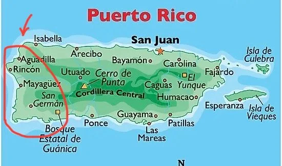 Map of Puerto Rico showing major cities, mountain ranges, and islands with a red arrow pointing from Isabella to the southwestern part of the island.