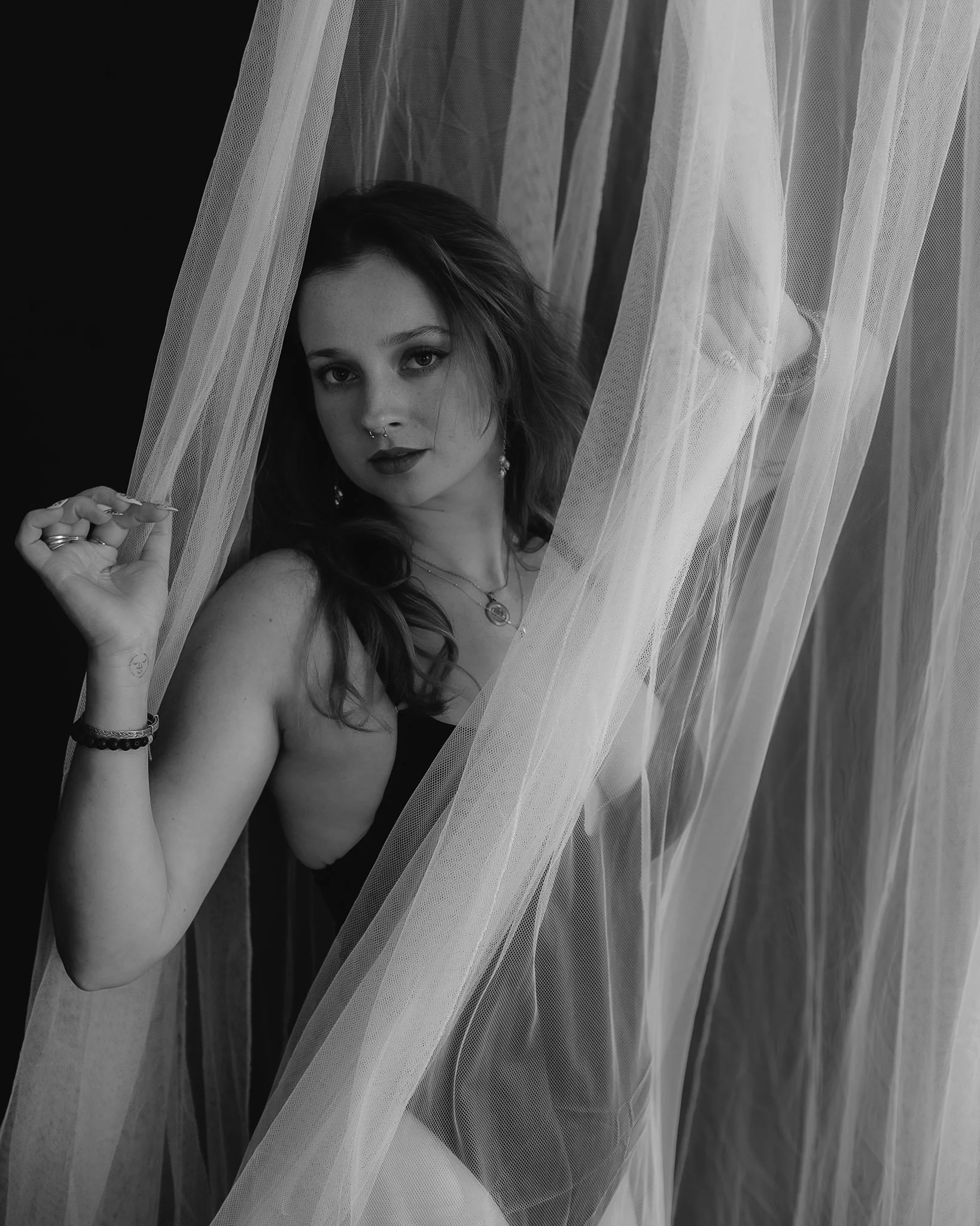 ""Soft daylight boudoir experience capturing authentic beauty"