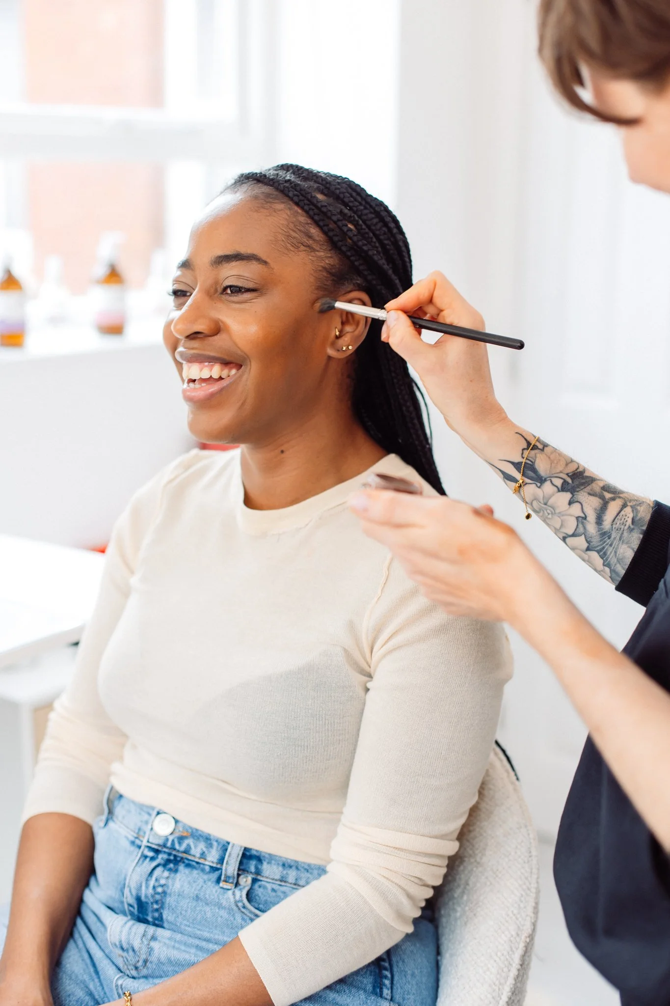 Makeup artist applying makeup for a boudoir shoot in Shropshire boudoir studio