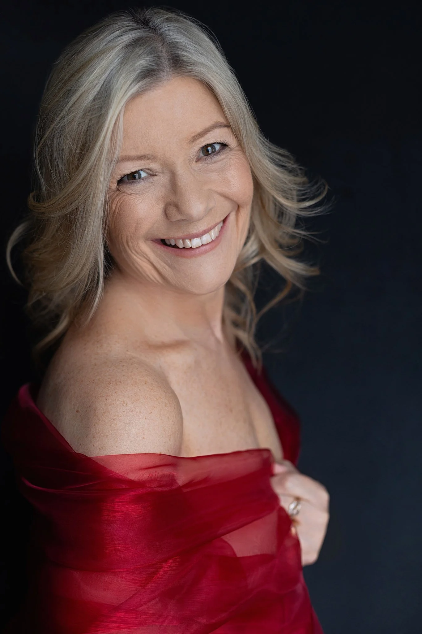 Woman over 50 smiling Shrewsbury boudoir experience