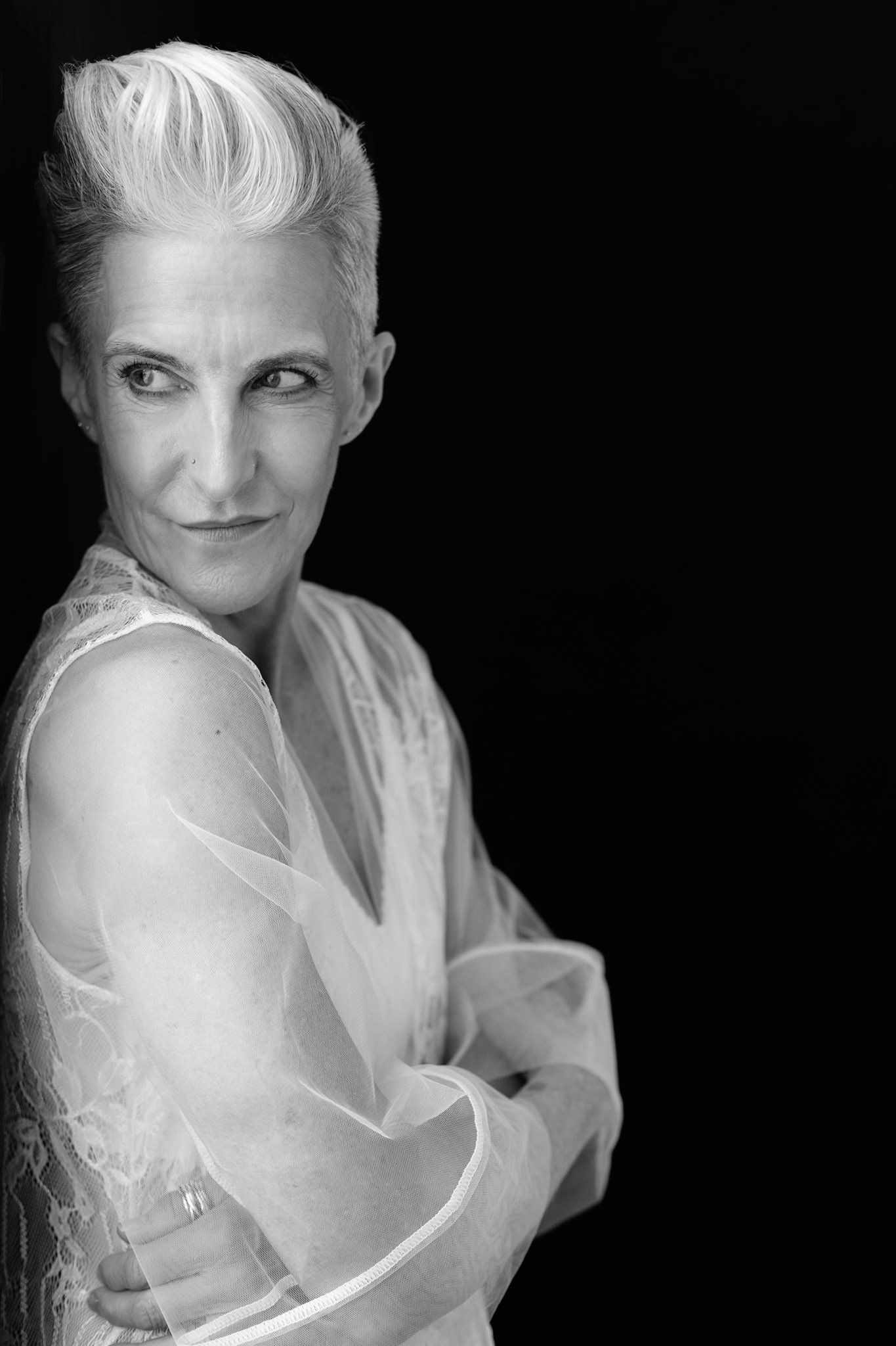 Women leaning up against wall in Shrewsbury boudoir studio.