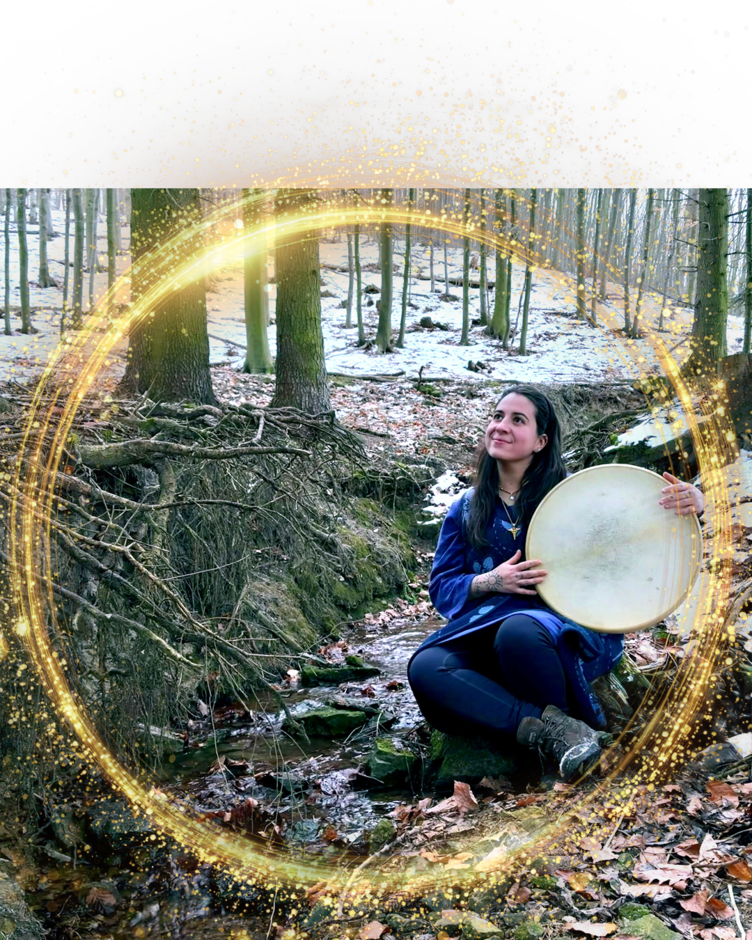A woman sitting by a small stream in a forest, holding a drum, with snow on the ground and trees around, surrounded by a glowing golden circular light.