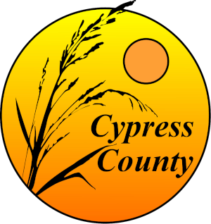 Sunset or sunrise over a field with tall grasses, with a yellow and orange gradient background. Text reads 'Cypress County'.