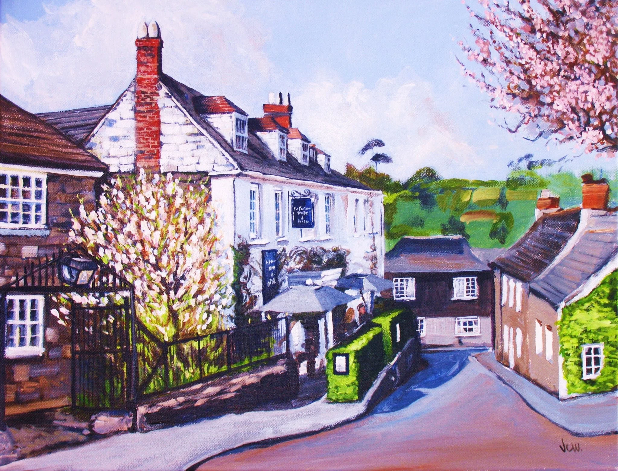 A colorful watercolor painting of a quaint village street with houses, blooming trees, and rolling green hills in the background.