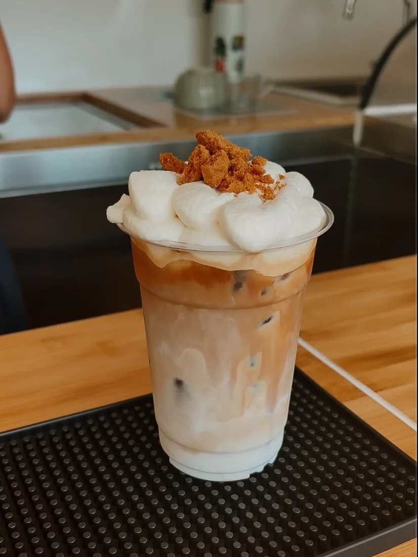 Couple of happy &ldquo;customers&rdquo; and an attempt at latte art