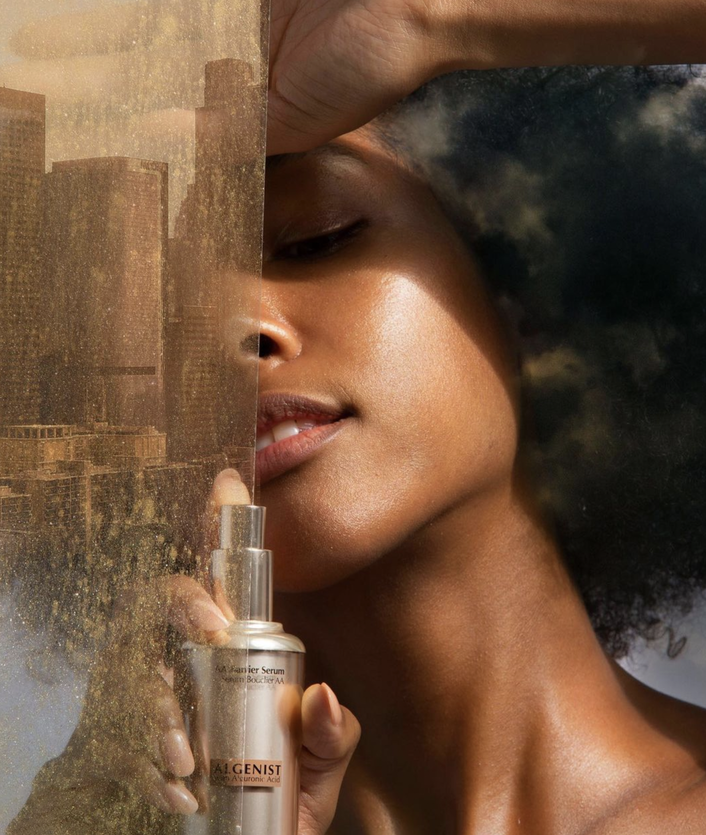 Algenist Skincare Brand Campaign for AA Barrier Serum in the hand of a model.
