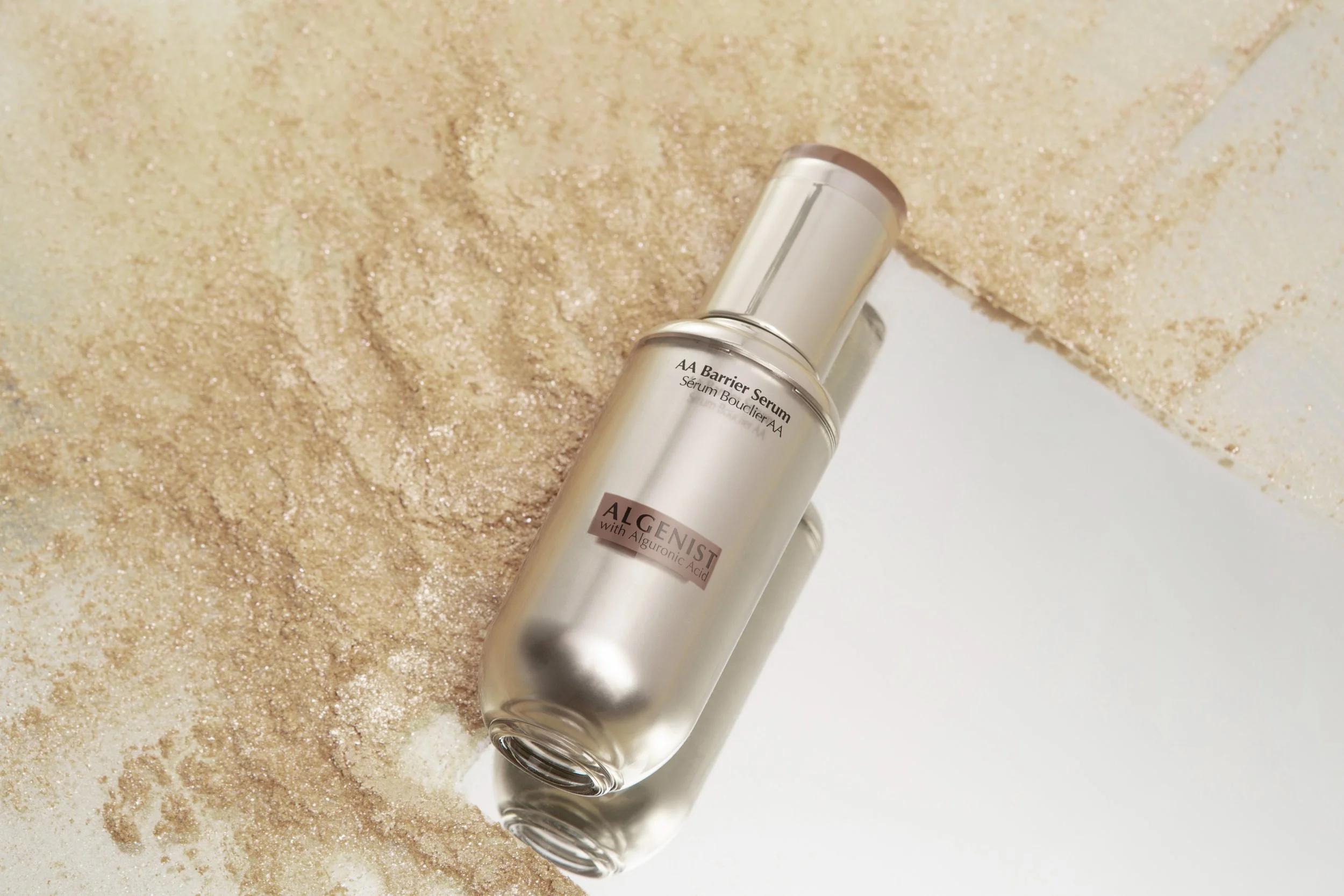 Algenist Skincare AA Barrier Serum wiping away environmental toxins.