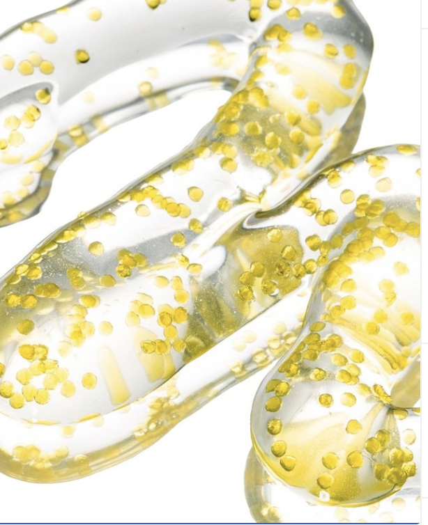 Algenist Genius Liquid Collagen serum shot up close to see the micro-algae beads.
