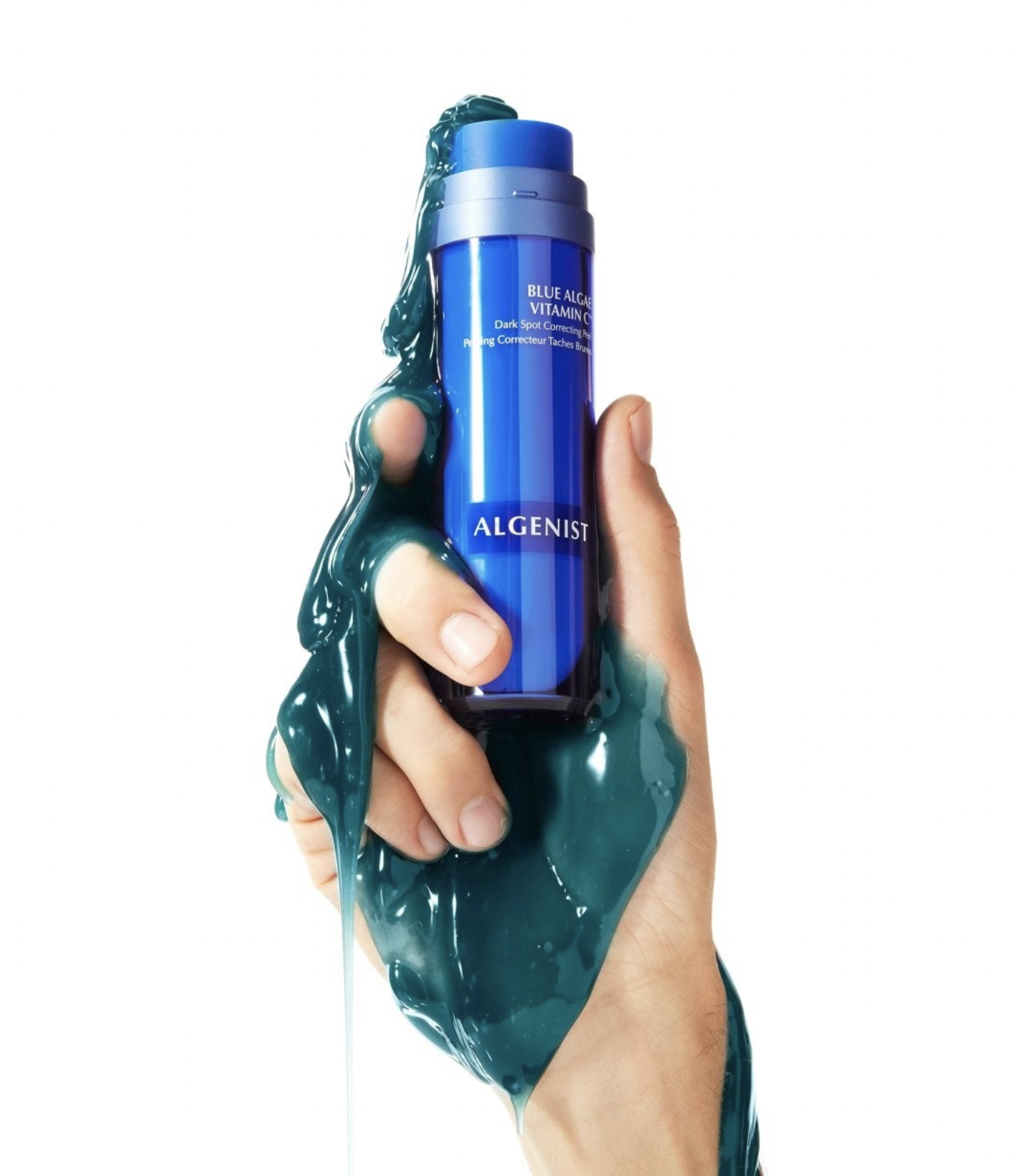 Agenist Skincare Blue Algae Vitamin C Serum Campaign serum shot in models hand.