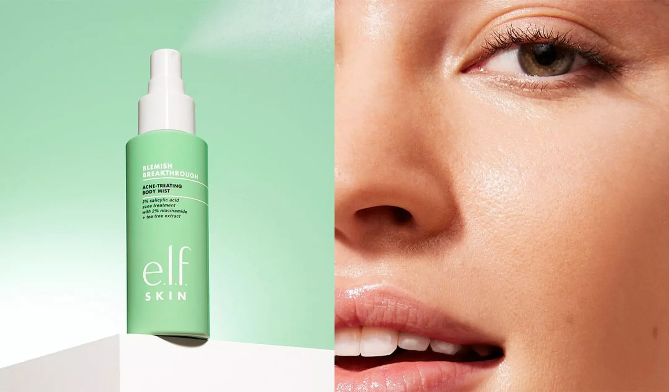A green bottle of e.l.f. Skin Blemish Breakthrough Acne-Treating Body Mist with a spray nozzle on a white platform, with a close-up of a woman's face showing clear skin on the right.