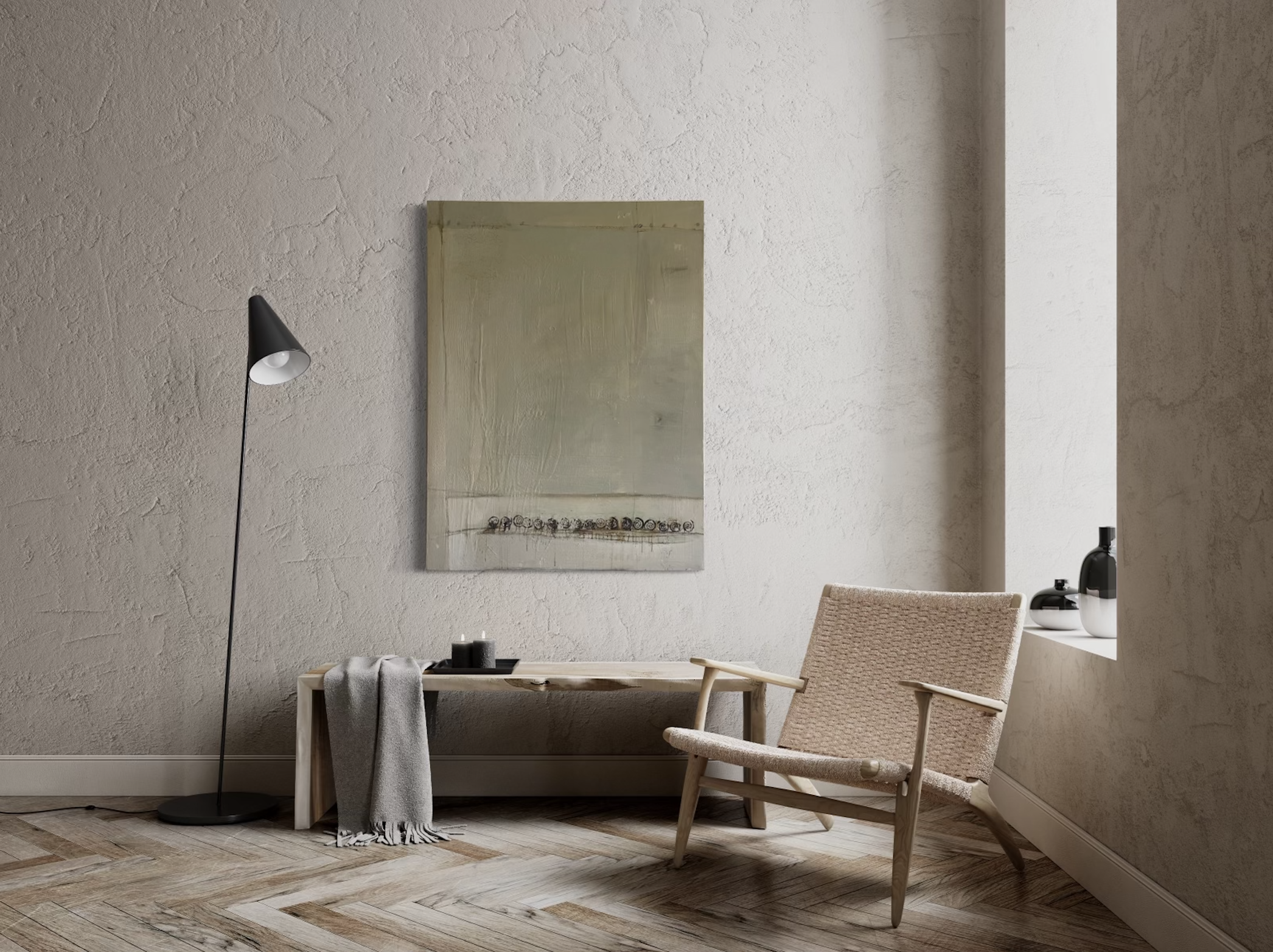 A minimalist interior living space with textured beige walls, a wooden floor, a beige armchair, a small wooden bench with a gray throw blanket, a black floor lamp, a large abstract painting, and a windowsill with three black and white decorative bott