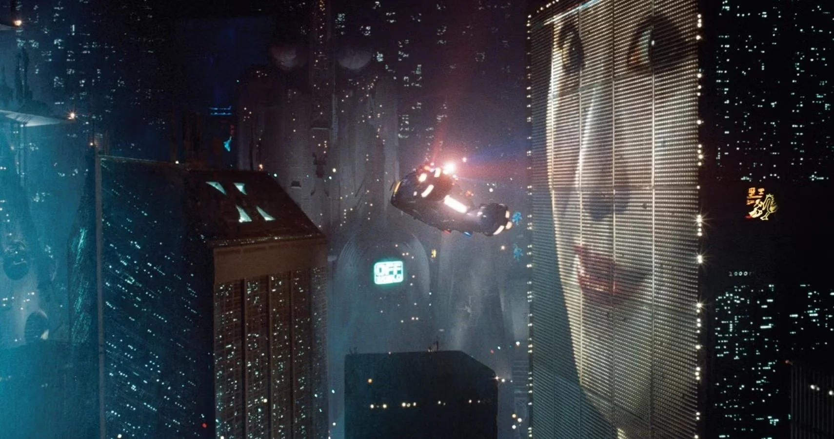Deckard's Spinner flies past a billboard in "Blade Runner"
